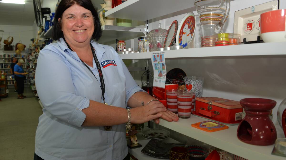 KITCHEN WARE: Cleveland Salvos manager Dana Dorrington with some of the kitchen ware for sale.