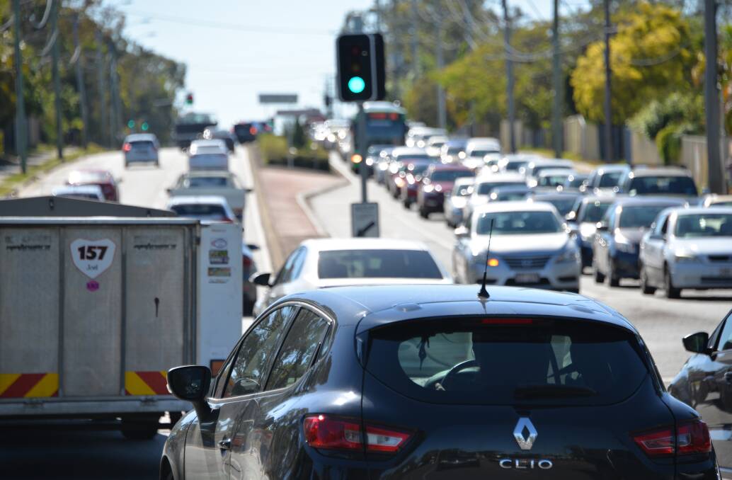 COMMUTER CHAOS: Peak hour traffic on Finucane Road which becomes Old Cleveland Road. It's a long drive ahead for these commuters. The busway would take buses out of traffic jams, radically cutting commute times.