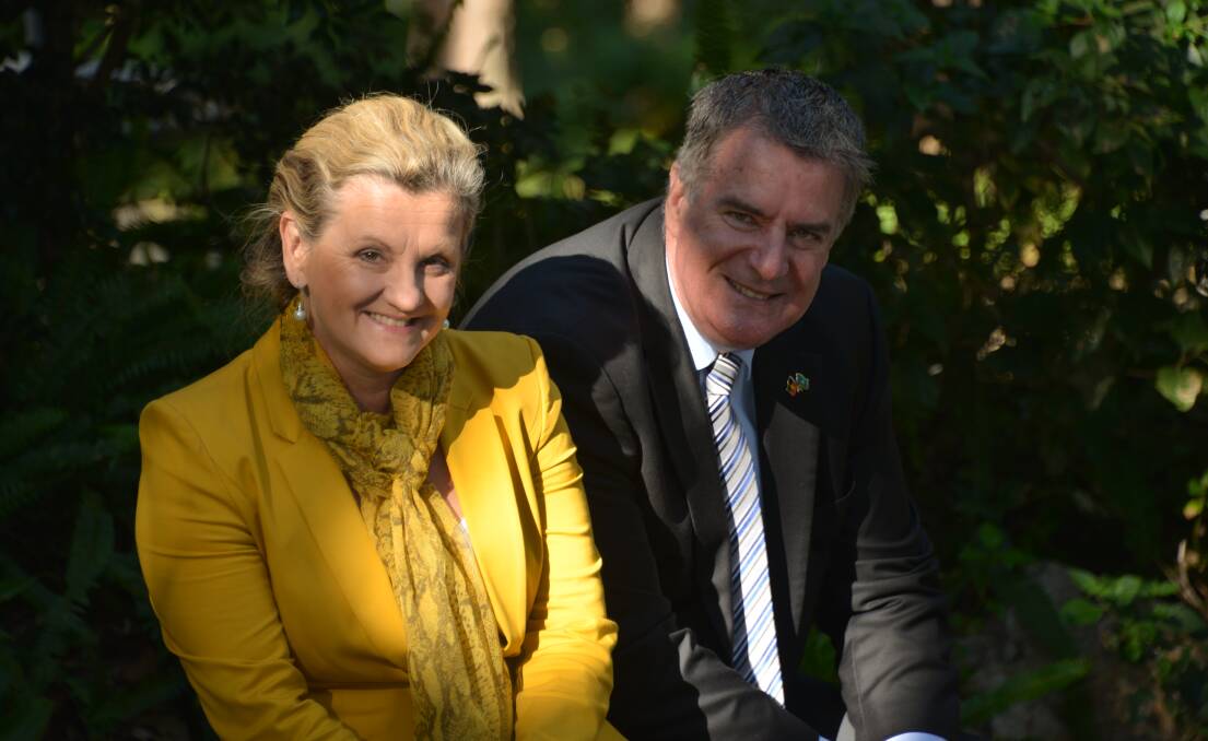 ARM SQUEEZING: Mayor Karen Williams and Local Government Minister Mark Furner at IndigiScapes.
