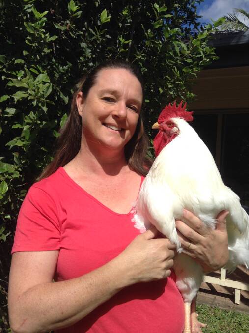 TALKING HENS AND ROOSTERS: Davina Carmichael with one of her chooks. She will speak at ROGI's next meeting.