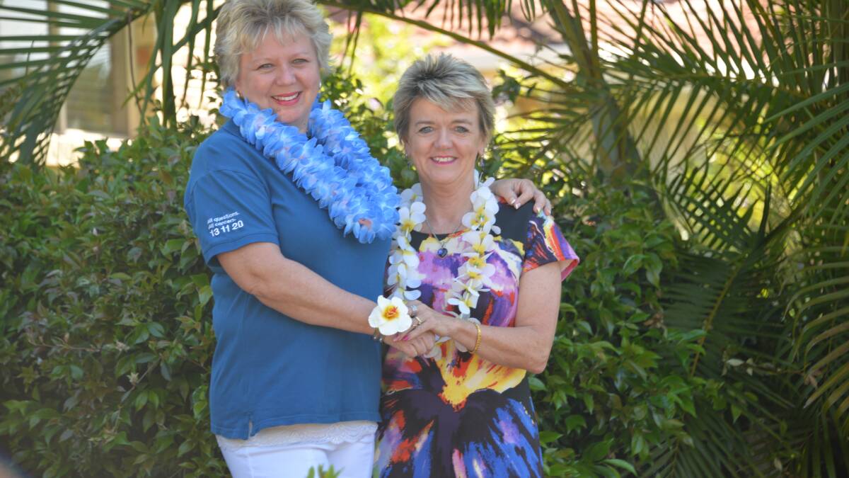 GIRLS' FUN: Tish Henderson and Carol Underwood of Cleveland got dolled up for last year's event, with a little tropical finery.