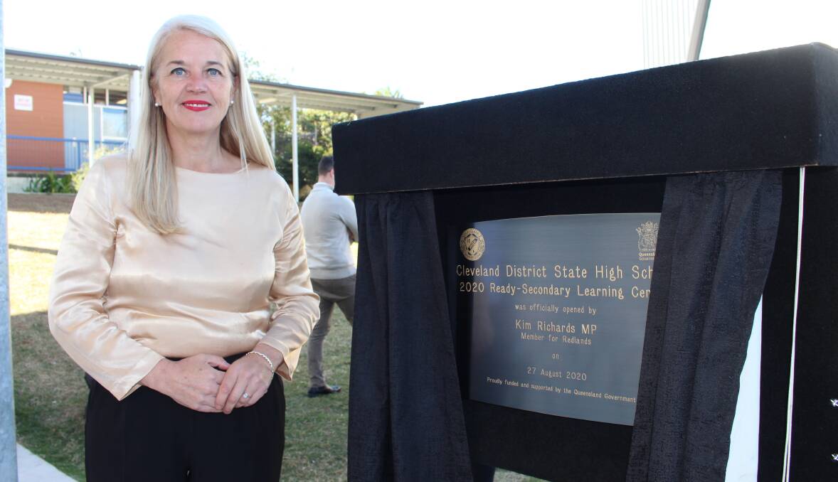 EDUCATION: Redlands MP Kim Richards unveils a plaque during the opening of Cleveland District State High School's new multi-storey learning centre. Photo: Jordan Crick