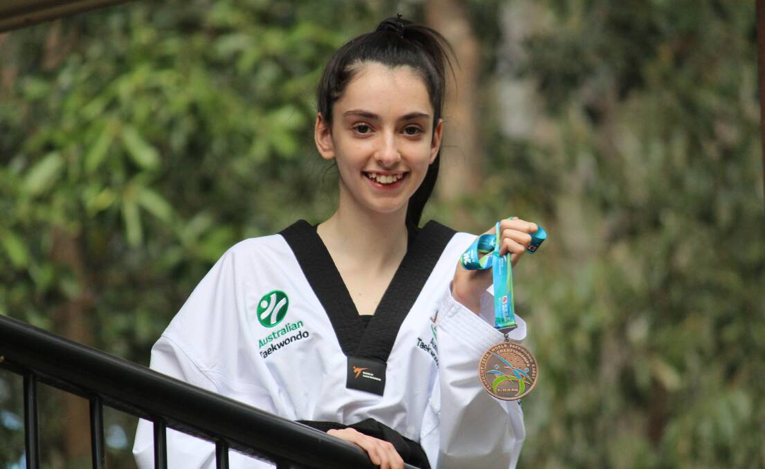 CHAMPION: Tiarnagh Sweeney proudly parading her bronze medal. 