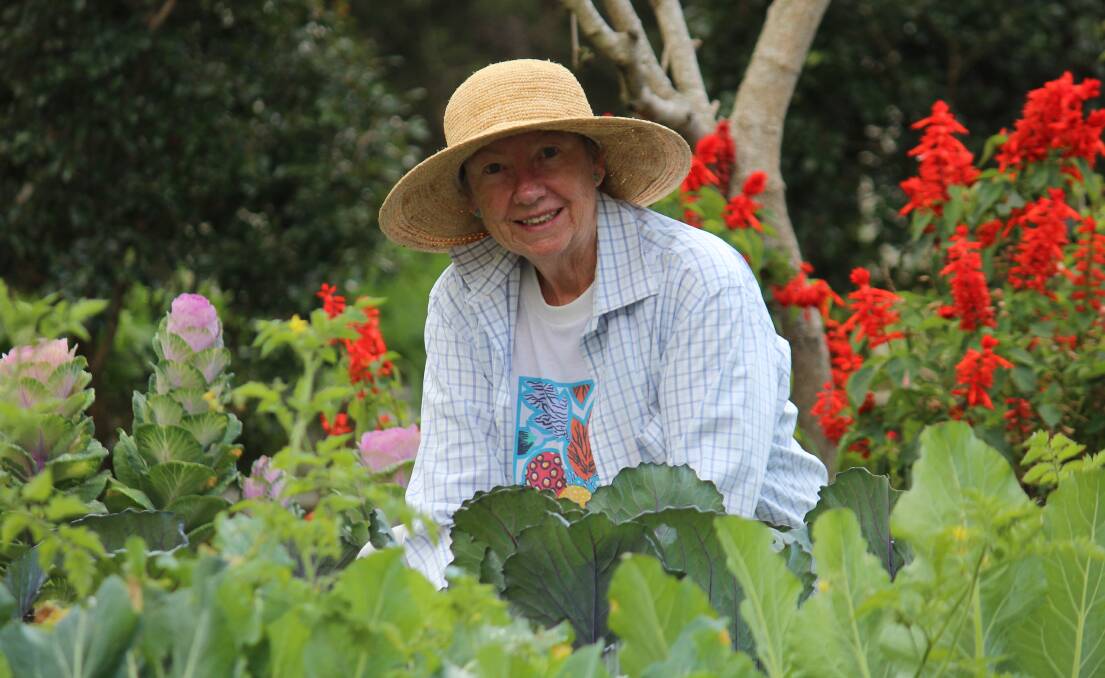 BLOSSOMING: Glenda Brown among the sprawling flower gardens. Photo: Jordan Crick. 