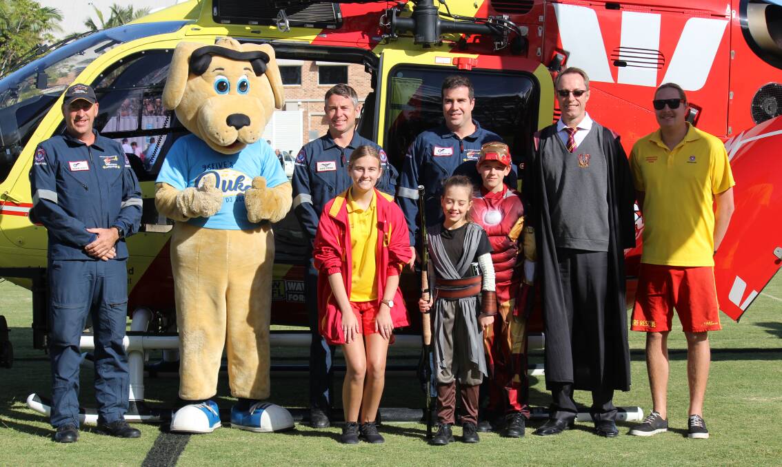 LANDING: Students get a visit from the Westpac Rescue Helicopter on the school oval. Photo: Jordan Crick. 