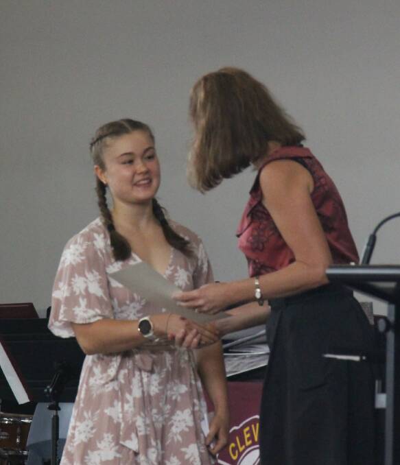TOP ACHIEVER: ATAR dux Eden Gorrel receives her award at the school's badge ceremony. Photo: supplied