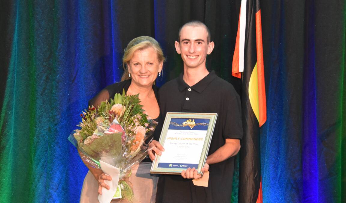COMMUNITY HERO: Layne Utz receives his highly commended award from Redlands mayor Karen Williams at the Redlands Coast Australia Day Awards. Photo: Jordan Crick. 