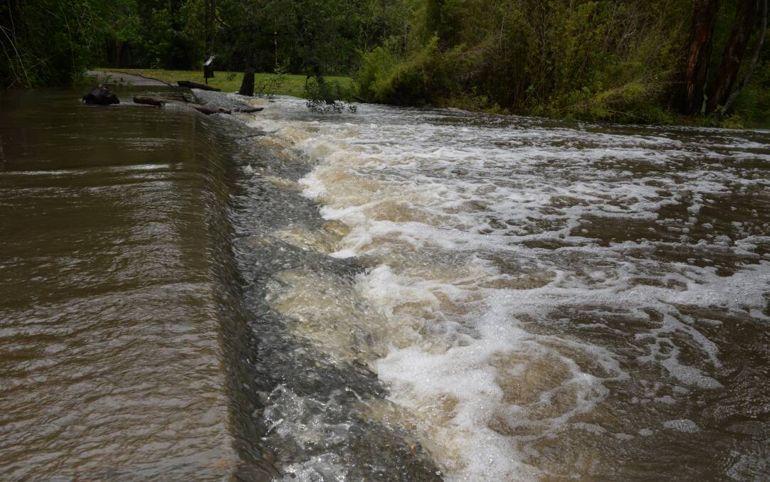 BIG WET: Hilliards Creek at Ormiston was flowing on Monday after a weekend of rain. Photo: Brian Williams
