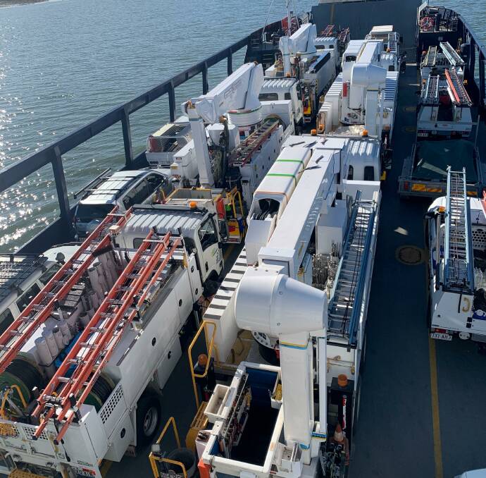 Energex trucks were transported to North Stradbroke Island via the barge. Photo supplied