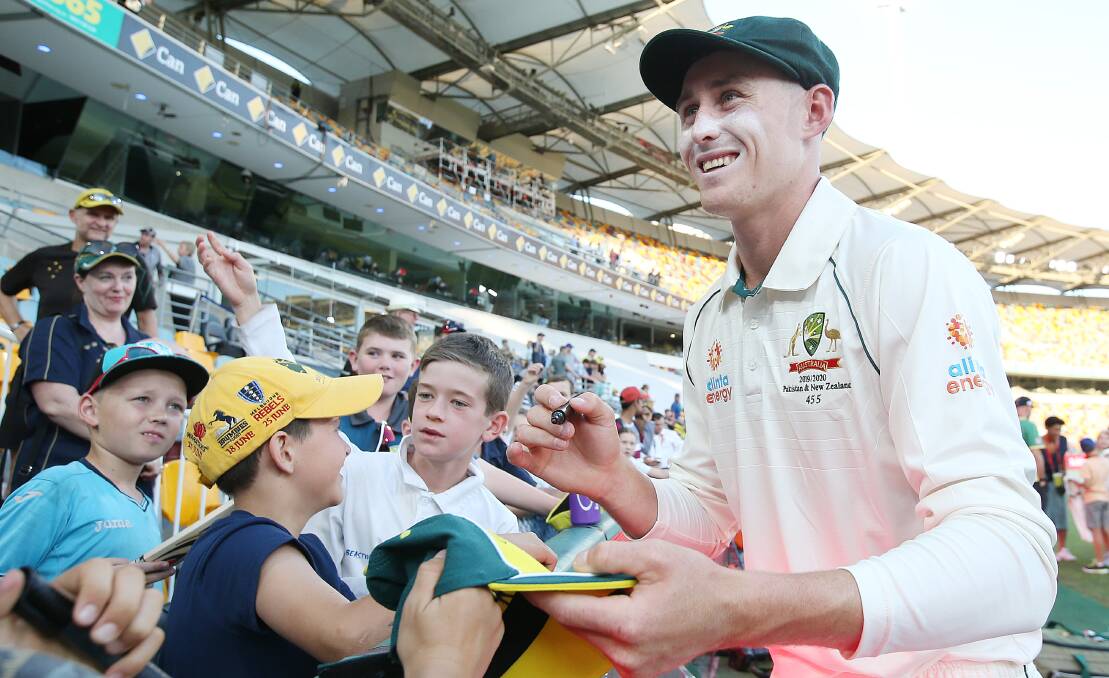 TOP SCORER: Marnus Labuschagne signing autographs during the test against Pakistan at the Gabba in Brisbane. Photo: Cricket Australia/Getty Images