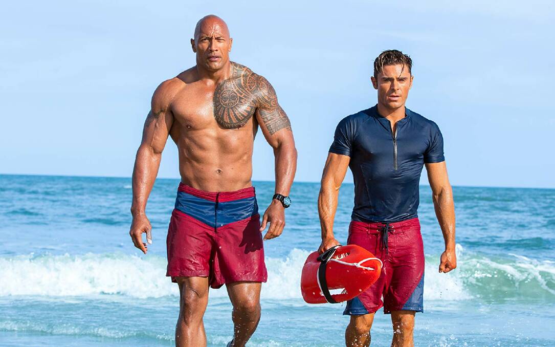 HOLLYWOOD CELEBS: Dwayne Johnson and Zac Efron in 2017 film Baywatch. 