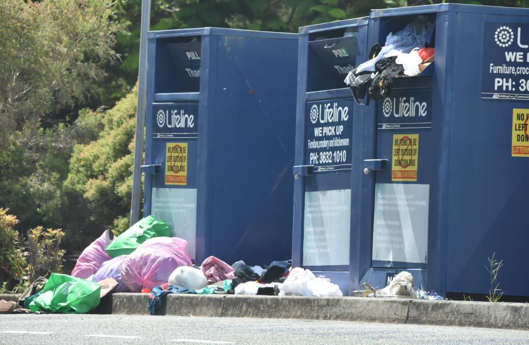 OVERFLOWING: Bags were left outside Lifeline bins at Wellington point last week. 