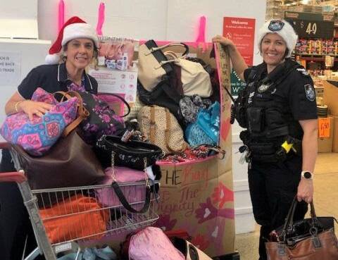 DONATIONS: Police officers dropped the bags off at a Bunnings Warehouse collection point. QPS staff, friends, family and the community pitched in. 