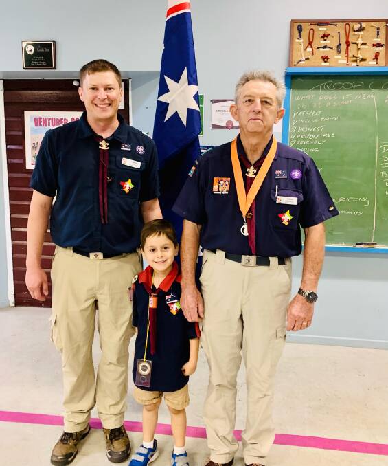 PROUD FAMILY: Scott Menzies and Stephen Menzies with grandson Alex Boobyer (middle) at his scouting investiture ceremony. 