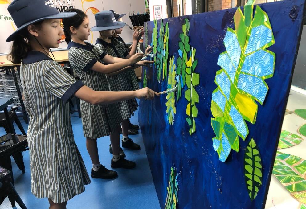 COLOURFUL CREATION: Redlands College students in grade two and four worked on a new mural for the school's reception hall.