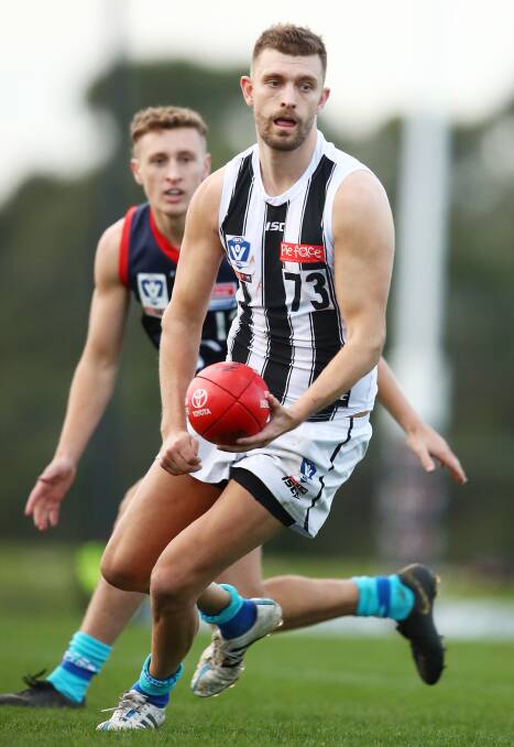 STAR: Adam Oxley with the ball for the Collingwood Magpies VFL side. Photo: Scott Barbour/AFL Photos.