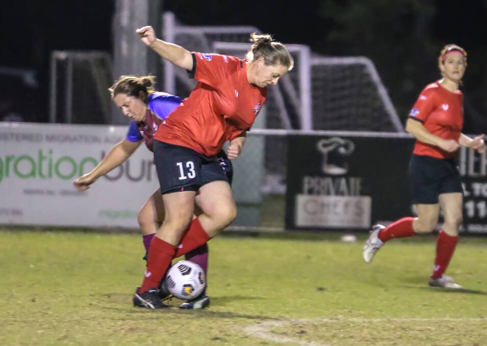 STAND-OUT: Sarah Mapstone wins the ball for Redlands United in the Women's Legends final against University of Queensland at Cleveland's Compass Grounds. Photo: Ray Gardner