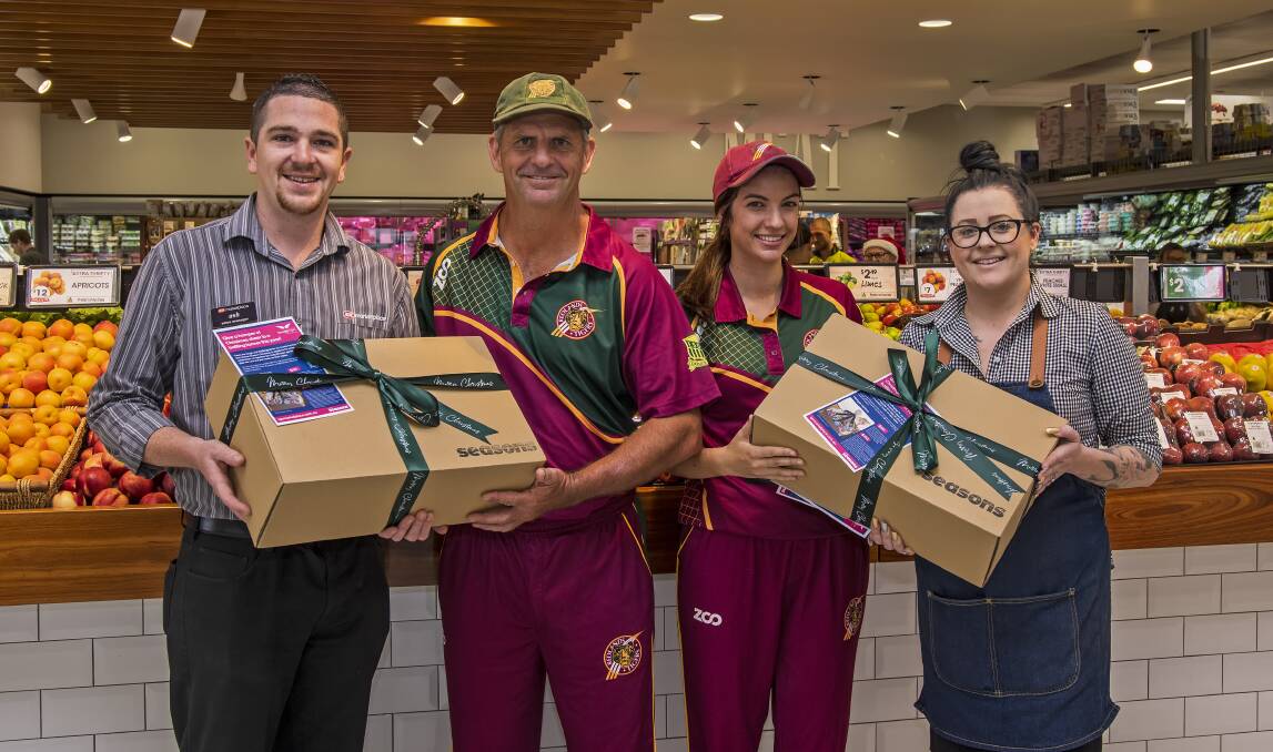 RELIEF: Matthew Williamson and Jessica Sanders bought 20 hampers from IGA Cleveland on behalf of the club to help the Drought Angels Christmas appeal. 