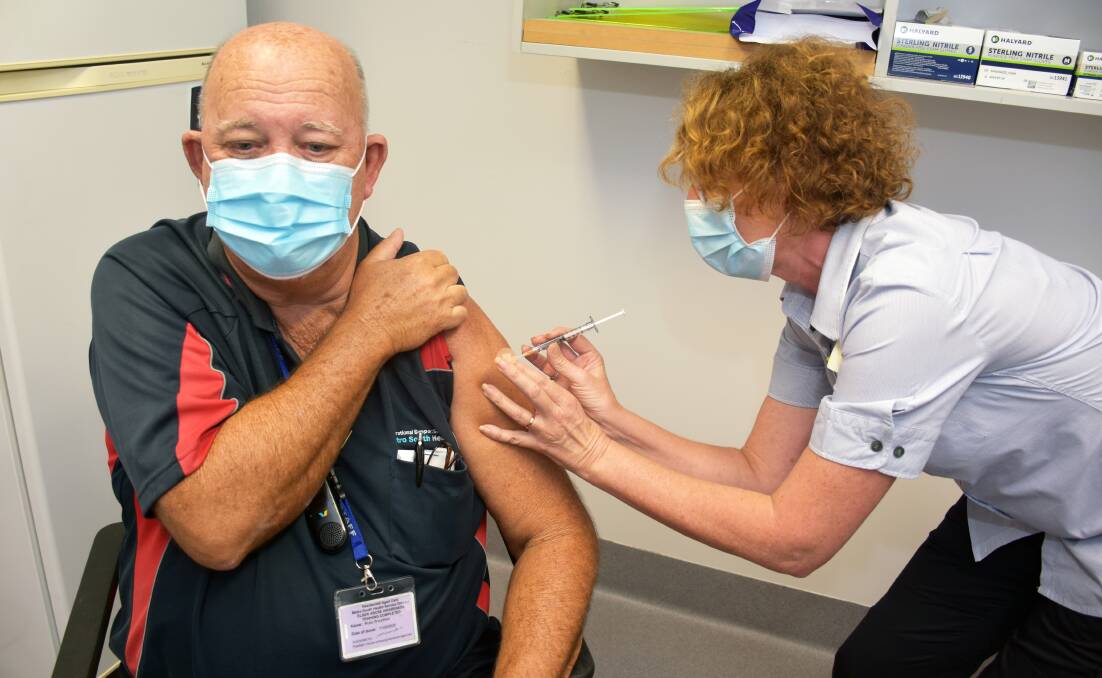 VIRUS BATTLE: Russ Woodrow receives a COVID-19 jab at Redland Hospital. A vaccine clinic opened at the hospital last week.. Photo: supplied. 