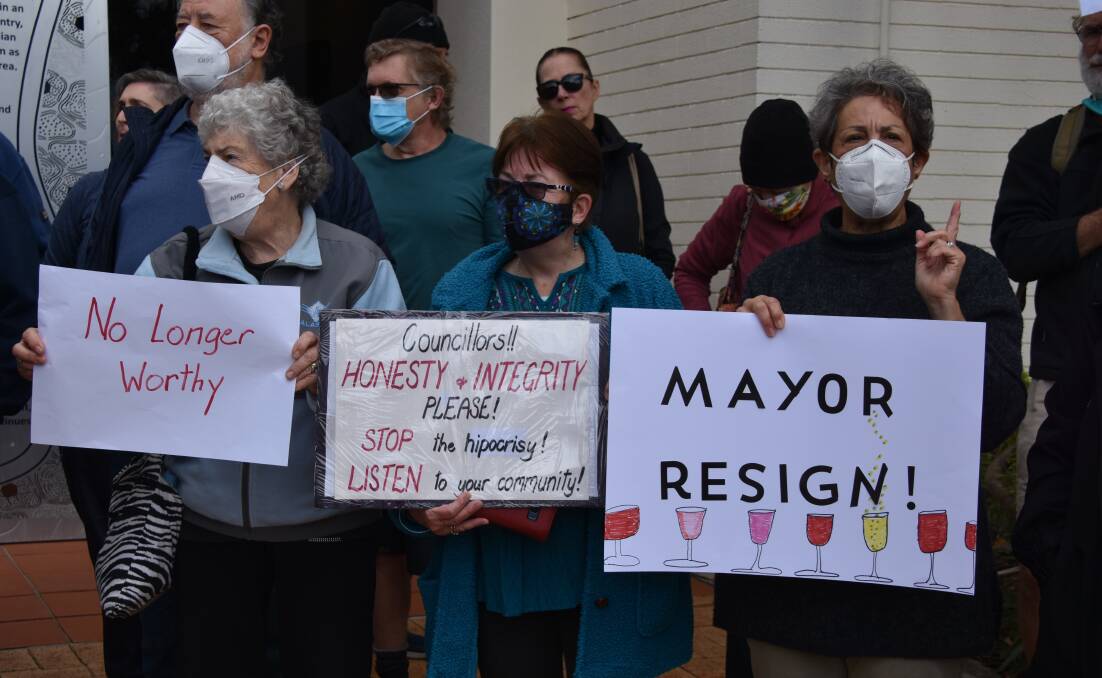 Ratepayers gathered outside council chambers before the general meeting, calling for Mayor Karen Williams to resign. Photo by Jordan Crick