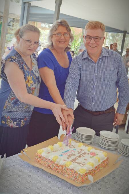 GRAND OPENING: Bush Oasis Op Shop managers Wendy McKeon and Kaye Brennan with Churches of Christ Queensland chief executive Gary Edward. 