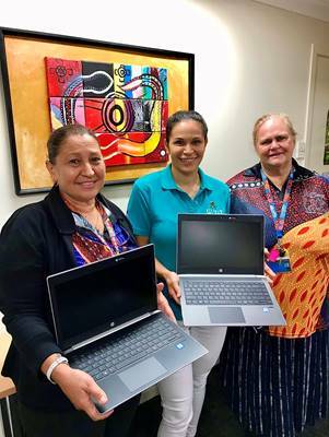 DONATION: COOEE staff were glad to be in possession of four laptops which are set to help their students further their studies. 