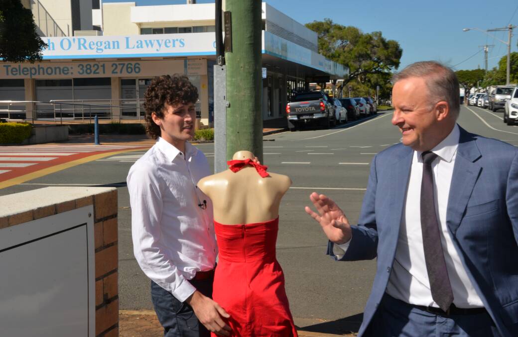 QUESTIONS ASKED: A man with a mannequin attempts to talk with opposition leader Anthony Albanese after the press conference at Cleveland. Photo: Jordan Crick