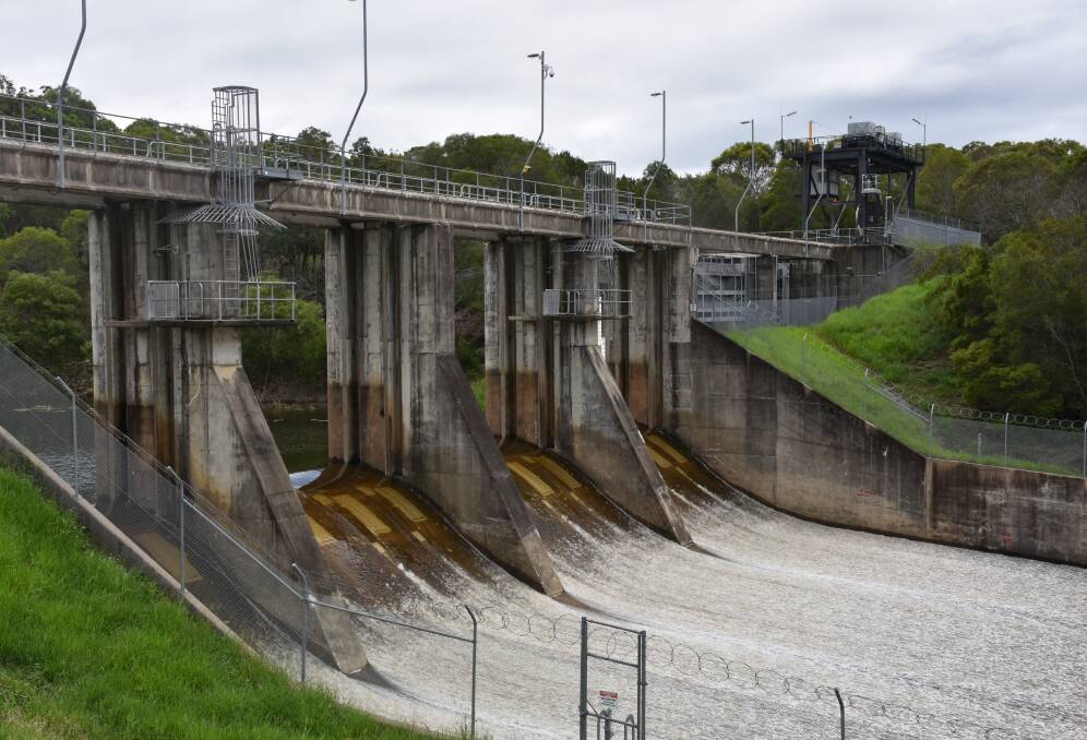 RAIN: The Leslie Harrison Dam has reached 107 per cent capacity, with water now flowing into the spillway. Photo: Jordan Crick