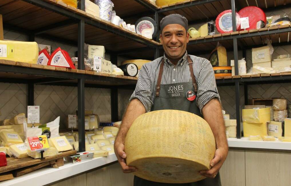 BIG GRINS: Mount Cotton IGA is known for its cheese and it is now known for its home delivery call centre service, which operates between 9am and 5pm each weekday. Photo: Cheryl Goodenough