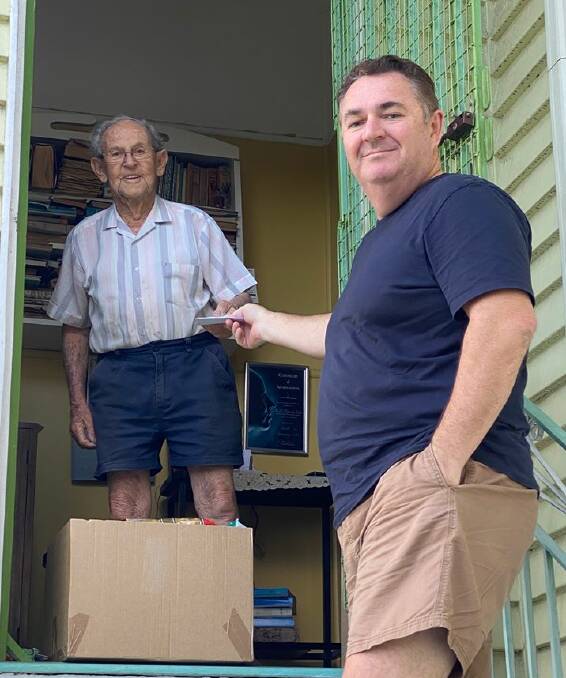 GIFT: Bayside South RSL sub-branch vice president Matt Dyson delivers a care package to the doorstep of member Keith.