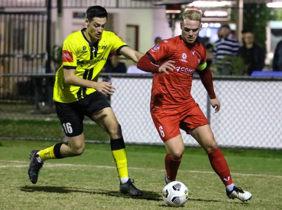 POWERFUL: Redlands United captain Sam Langley with the ball at his feet during Saturday night's game against Moreton Bay United at the Compass Grounds. Photo: Ray Gardner