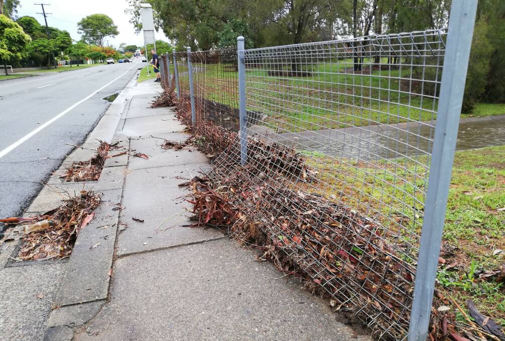 GLOOMY: The storm water drains were full after Saturday's bout of showers. Photo: Peter Mackie