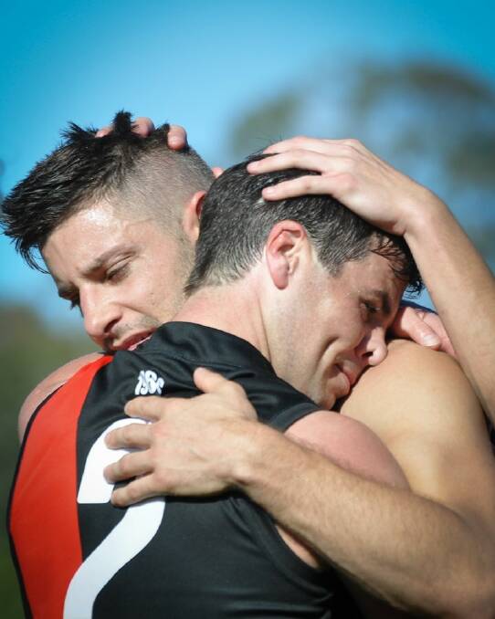 Phil Carse and Tom Salter embrace after the victory. Photo: Highflyer Images/ Redland FC.