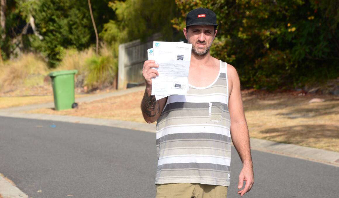 GUTFUL: Armando Respondino is fed up with parking tickets he has recieved for parking on the nature strip outside his house. Photo: Jordan Crick. 