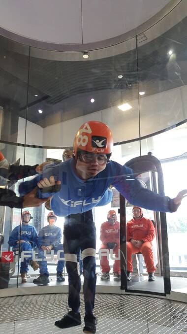 LIFT OFF: Riley, 19, gets some air at Tea-Cup Cottage Events' trip to iFly Brisbane. The program has gone down a hit with participants so far. 
