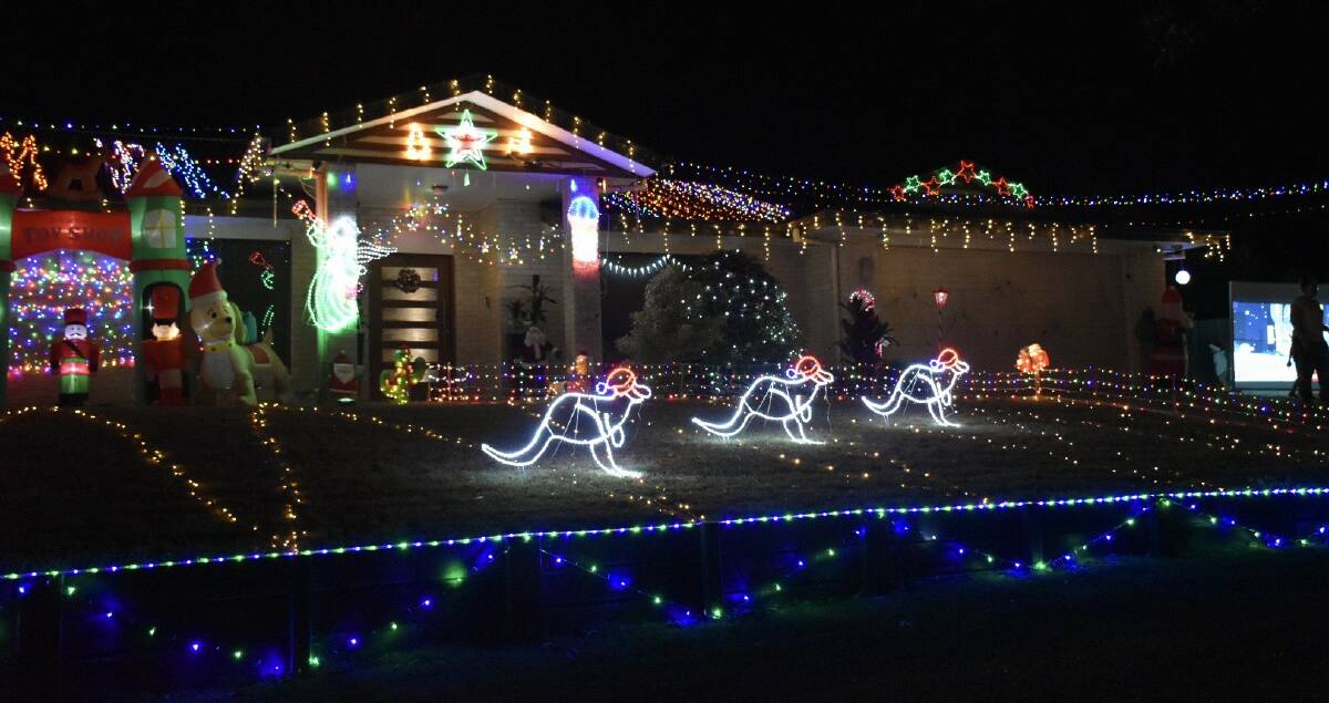 EVENING DELIGHT: The boys' magical Christmas lights display at Redland Bay. Plenty of effort has gone into the design. 