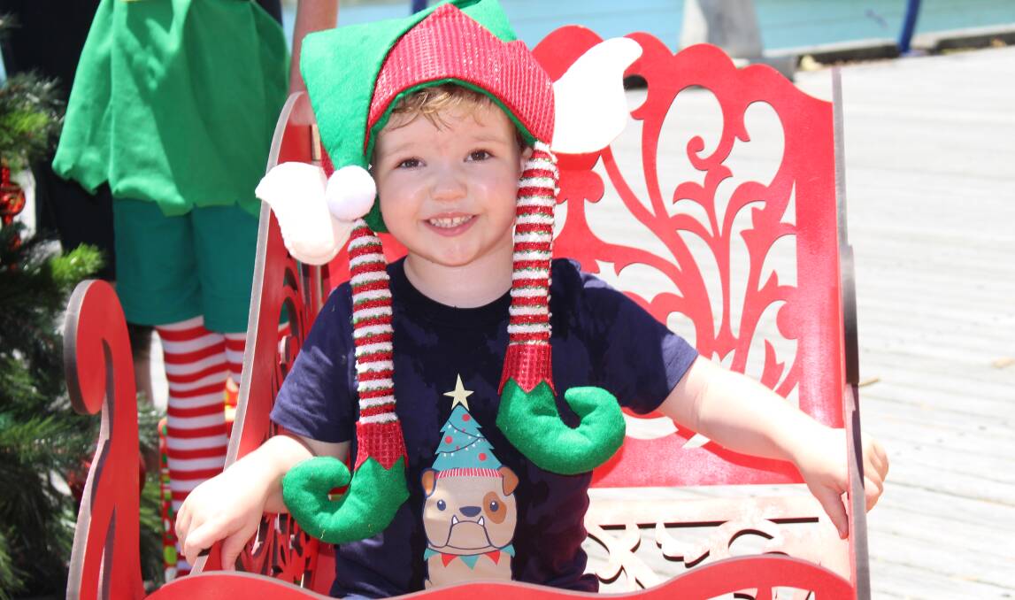 JOLLY: Carter Brown, 2. of Cleveland, was all smiles on the bay ahead of council's Christmas on the Coast festival. Photo: Jordan Crick