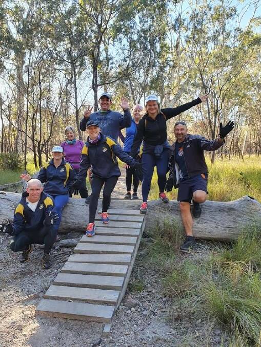 GROUP EFFORT: A team assembled to run seven kilometres for seven days in seven Redlands suburbs. They raised more than $2500 for child protection charity Bravehearts. 