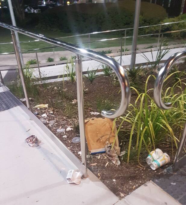 MESS: A Redlands commuter was disgusted to find the gardens at Victoria Point station lined with rubbish. 
