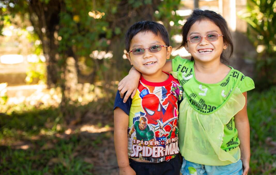 FAMILY: Shoua and Blong all smiles after having their cataracts removed. They are now free to live happily in their remote Laos village. 