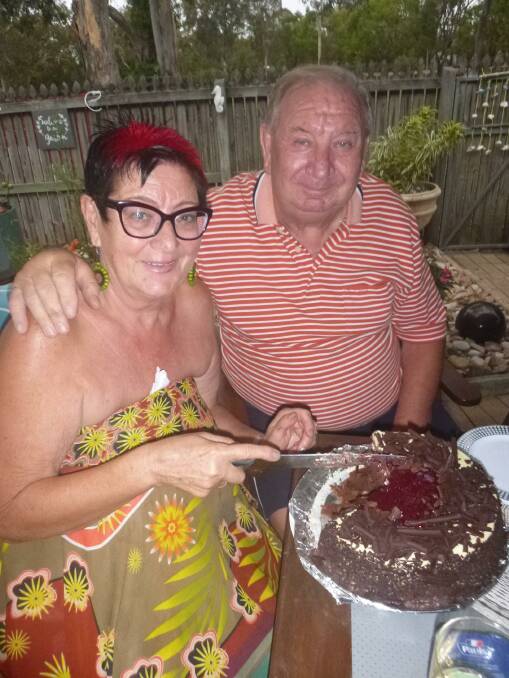 RAISE THE BAT: Brian and Maria Brown enjoy a cake to celebrate 50 years of marriage. 