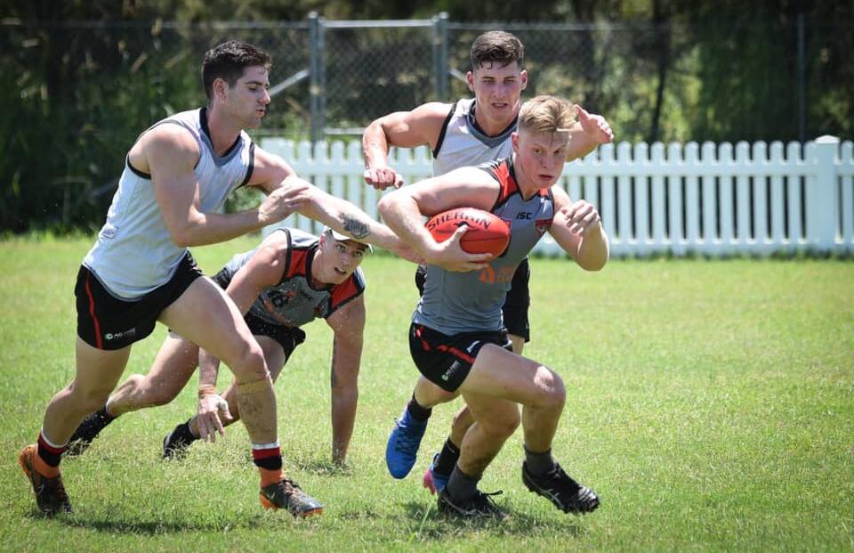 HARD YAKA: The Redland Bombers were put through their paces during a pre-season camp at Byron Bay last week. 