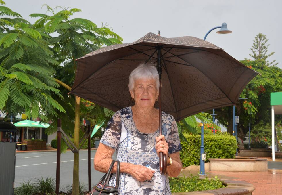SOGGY: Joan Burke watched the rain roll in at Cleveland while waiting for a bus. Photo: Jordan Crick. 