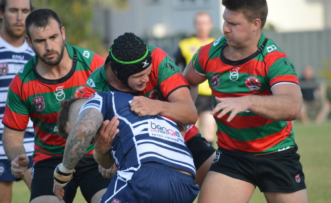 BRUTAL: A Brothers player takes a hit up in the sudden-death semi-final clash against Redlands on the weekend. Photo: Mike Simpson