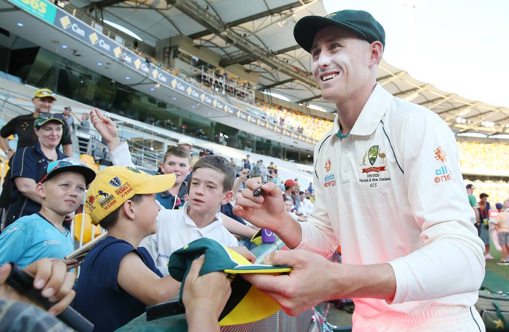 MAN OF THE HOUR: Marnus Labuschagne signing autographs during the first test against Pakistan at the Gabba in Brisbane. Photo: Cricket Australia/Getty Images
