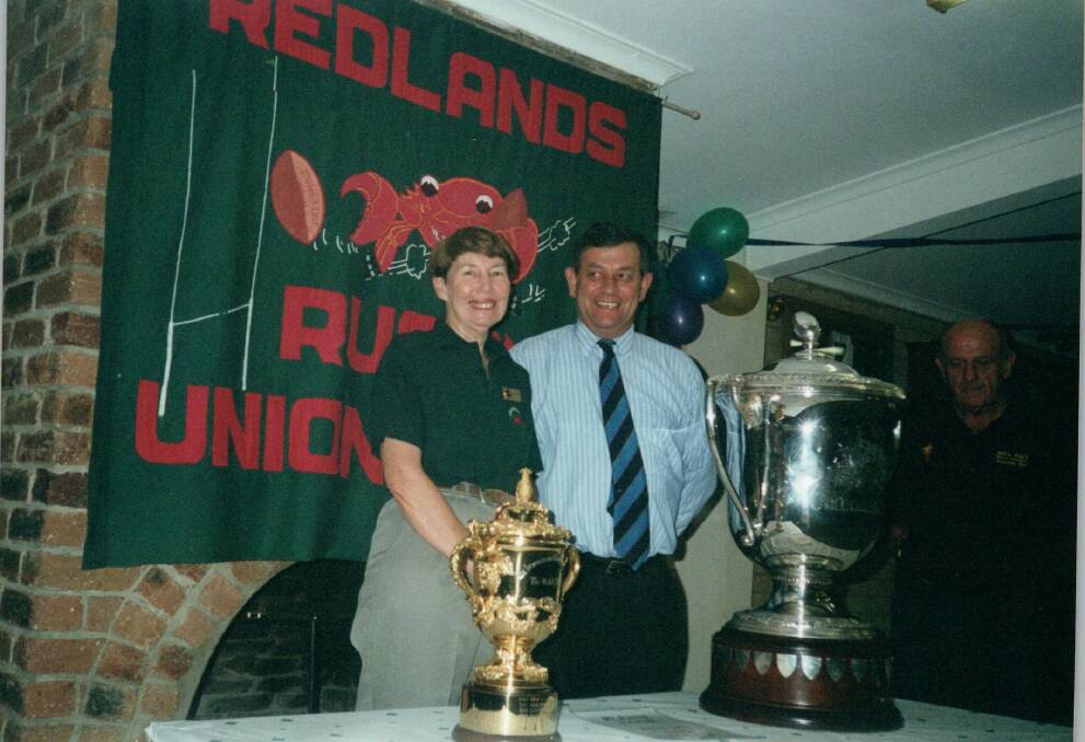 MUDDIES: Judy Holt and Eddie Santagiuliana with the Bledisloe Cup at the club in 2000. 