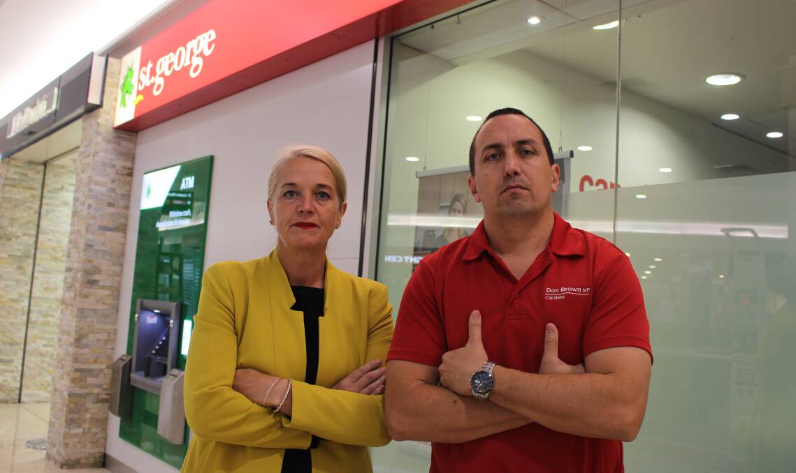 JOB LOSSES: Redlands MP Kim Richards and Capalaba MP Don Brown outside the Capalaba St George Bank branch earmarked for closure. 