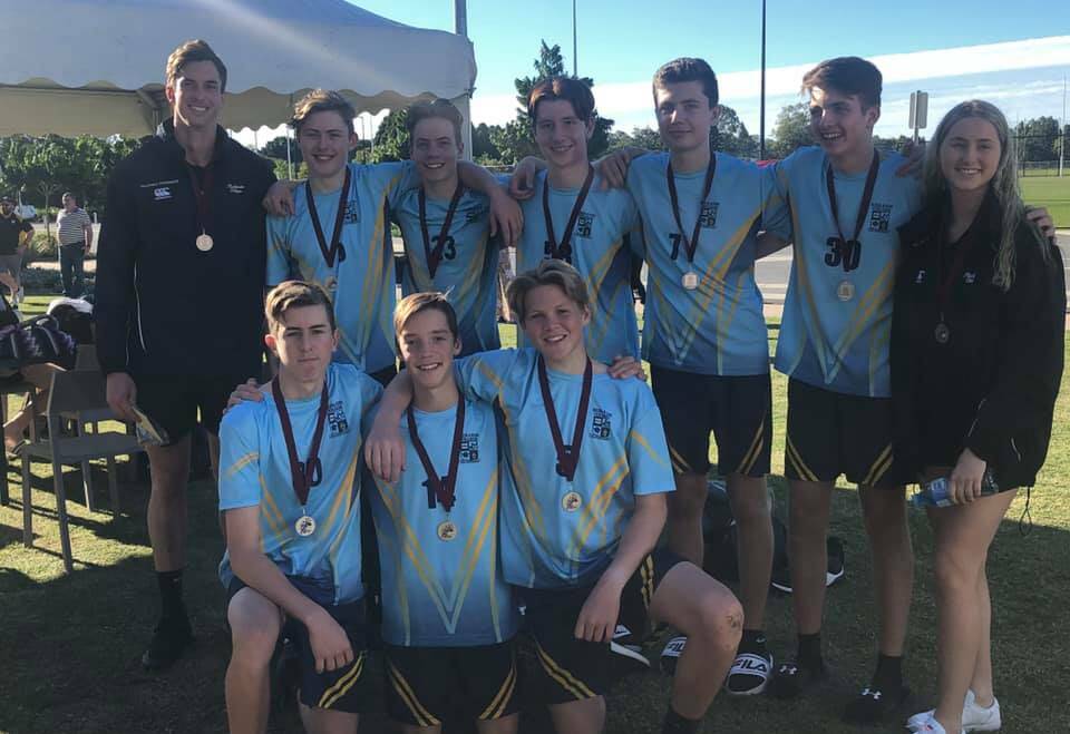 WINNING SMILES: The year 11 boys division one team was coached by James Miller and Breanna Monck (right). The team was made up of Kai Coleman, Adam Fox, Eli Kemp, Thomas McKinney, Caleb Walker, Gian-Luca Wullschleger, Daniel Morgan and Matthew Monck. 