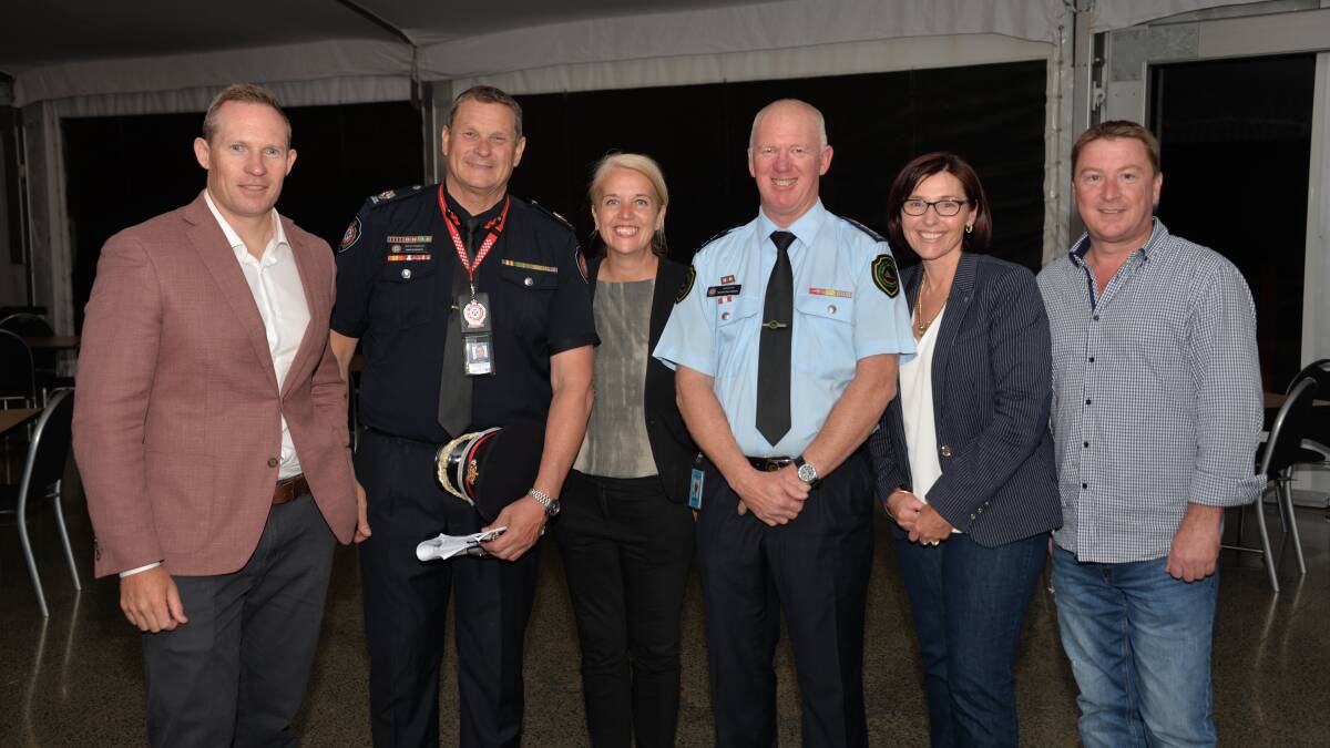 TALL ORDER: MP Mick de Brenni, MP Kim Richards, Cr Julie Talty and Cr Paul Gleeson with representatives of Queensland Fire and Emergency Services at the Mount Cotton community meeting on Thursday. 