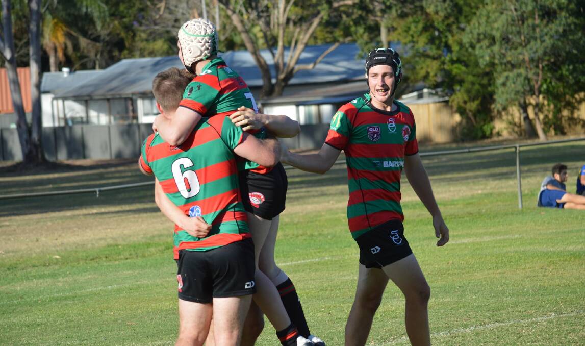VICTORY: Redlands Parrots players celebrate a try in their 24-22 upset of Brothers at the weekend. Photo: Mike Simpson